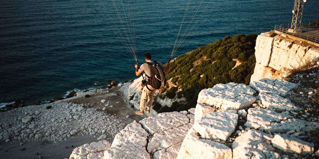 Turkey's 'white cliffs' become paragliding hotspot despite swimming ban and safety concerns
